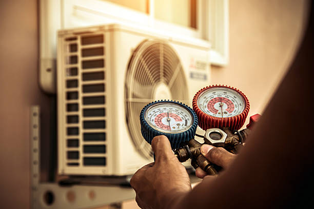 Professional Air Conditioning Service technician working in Gentry, AR